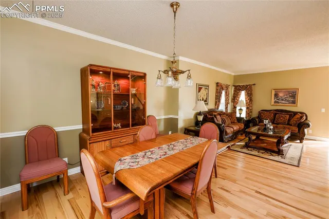 a view of a swimming pool with outdoor seating