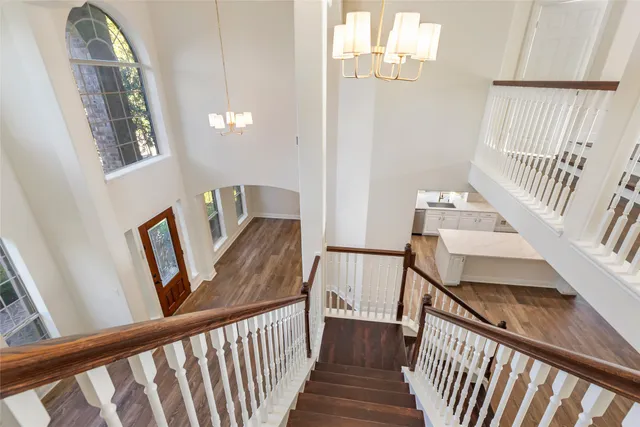 a view of a room with wooden floor and window