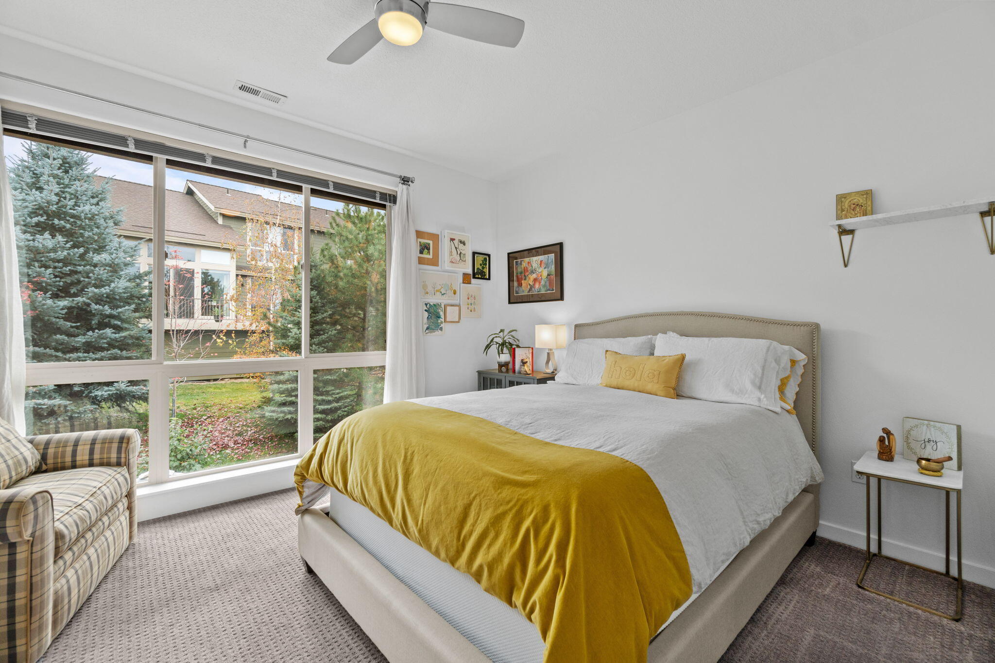 10942 Village Loop Redmond, OR 97756 - Photo 17 of 45 a bed sitting in a bedroom next to a window