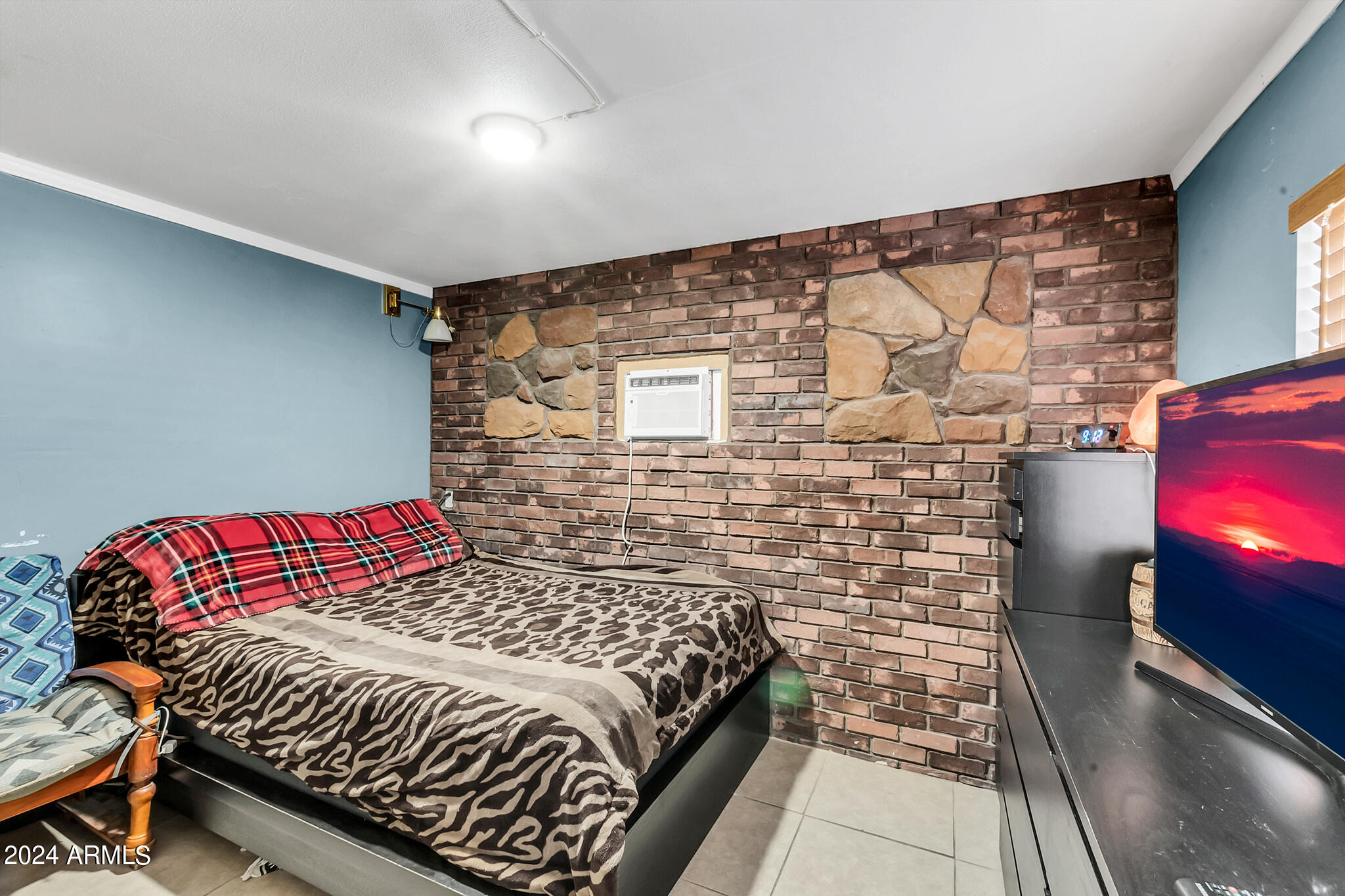 130 East McKellips Road, Unit 48 Mesa, AZ 85201 - Photo 11 of 24 a bedroom with a bed and a television