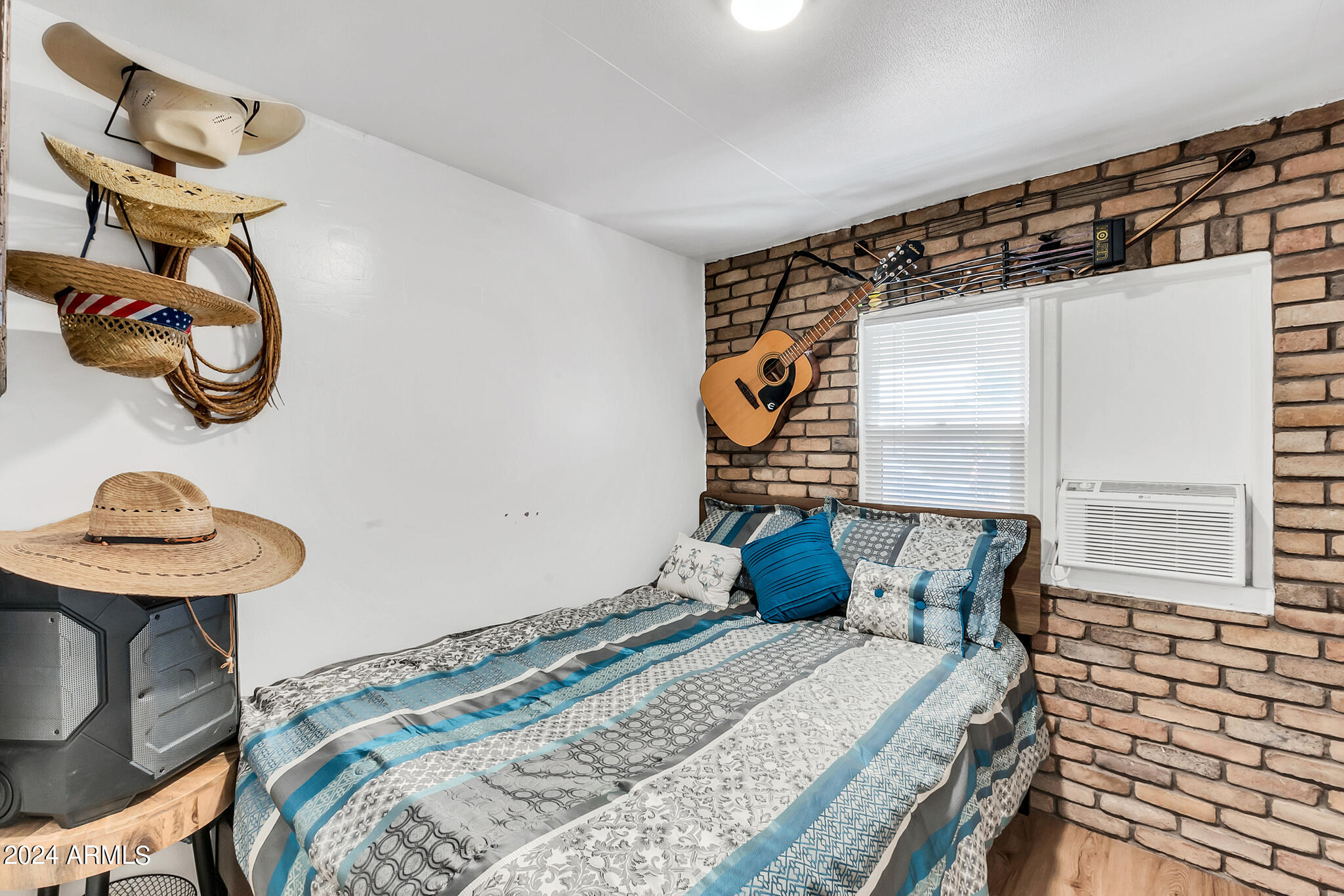 130 East McKellips Road, Unit 48 Mesa, AZ 85201 - Photo 15 of 24 a bedroom with a bed and cabinets