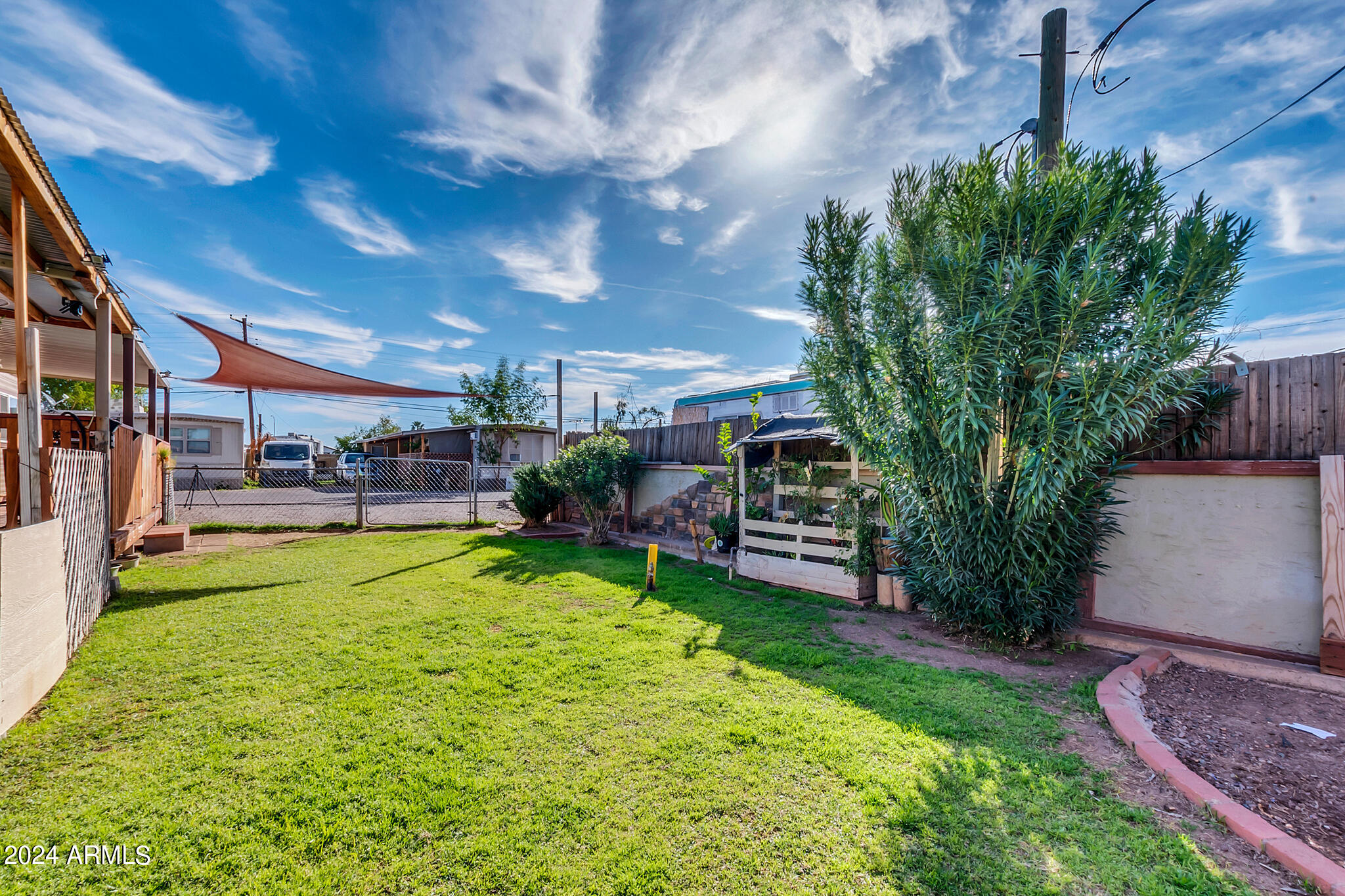 130 East McKellips Road, Unit 48 Mesa, AZ 85201 - Photo 17 of 24 a view of a backyard with furniture