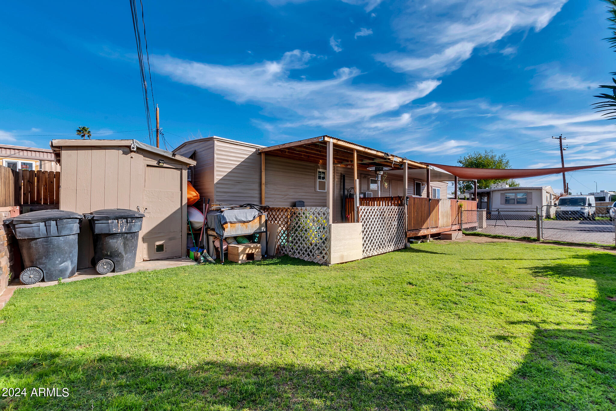 130 East McKellips Road, Unit 48 Mesa, AZ 85201 - Photo 20 of 24 a view of a house with a yard and sitting area