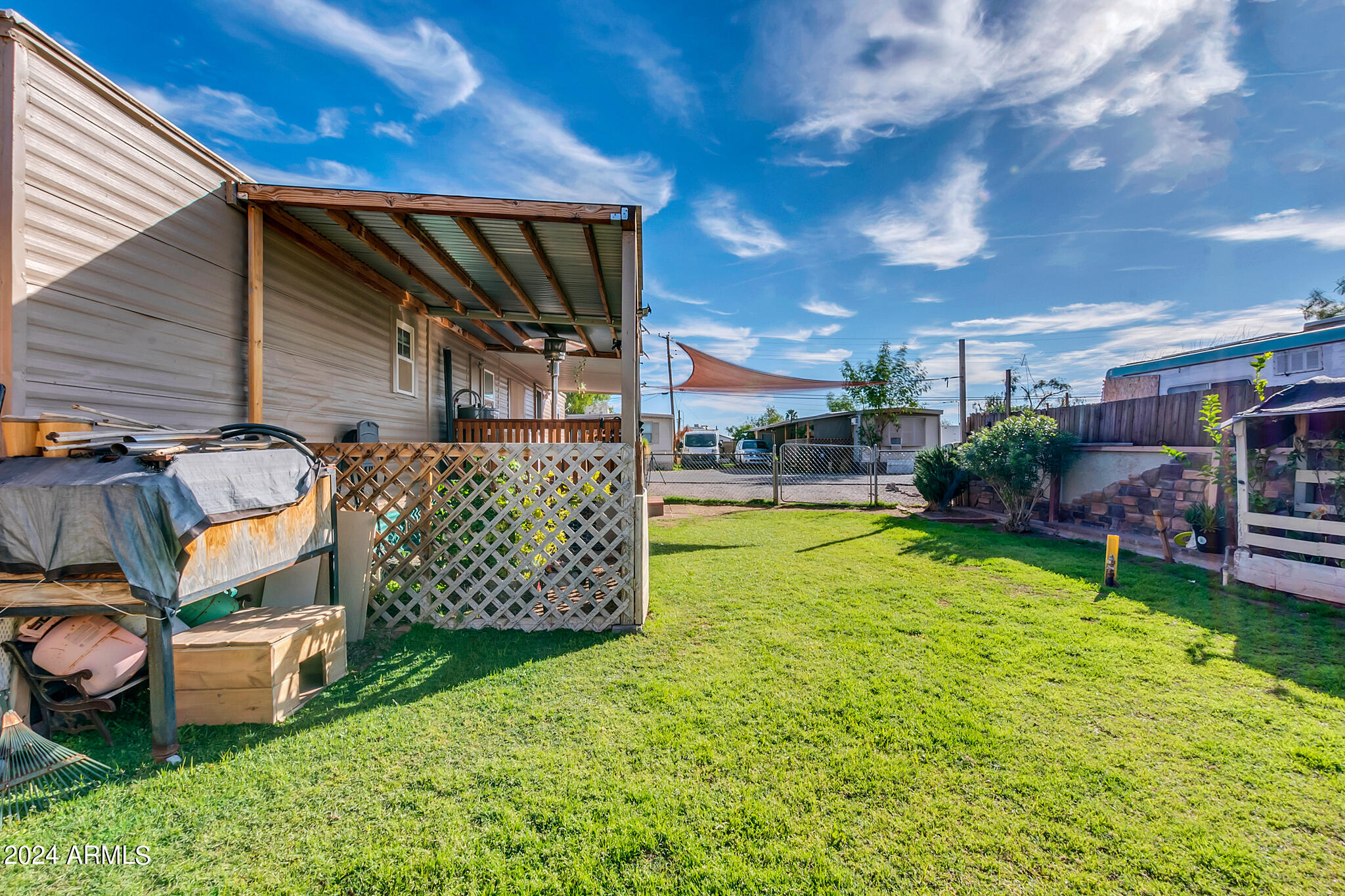 130 East McKellips Road, Unit 48 Mesa, AZ 85201 - Photo 22 of 24 a view of a backyard with sitting area