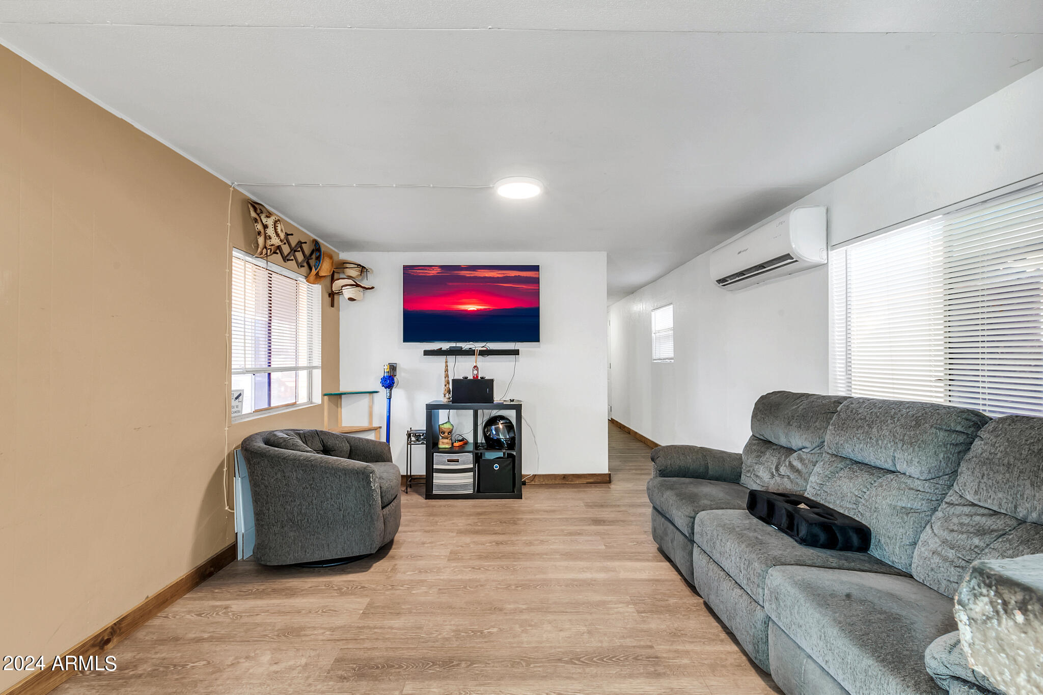 130 East McKellips Road, Unit 48 Mesa, AZ 85201 - Photo 7 of 24 a living room with furniture and a flat screen tv