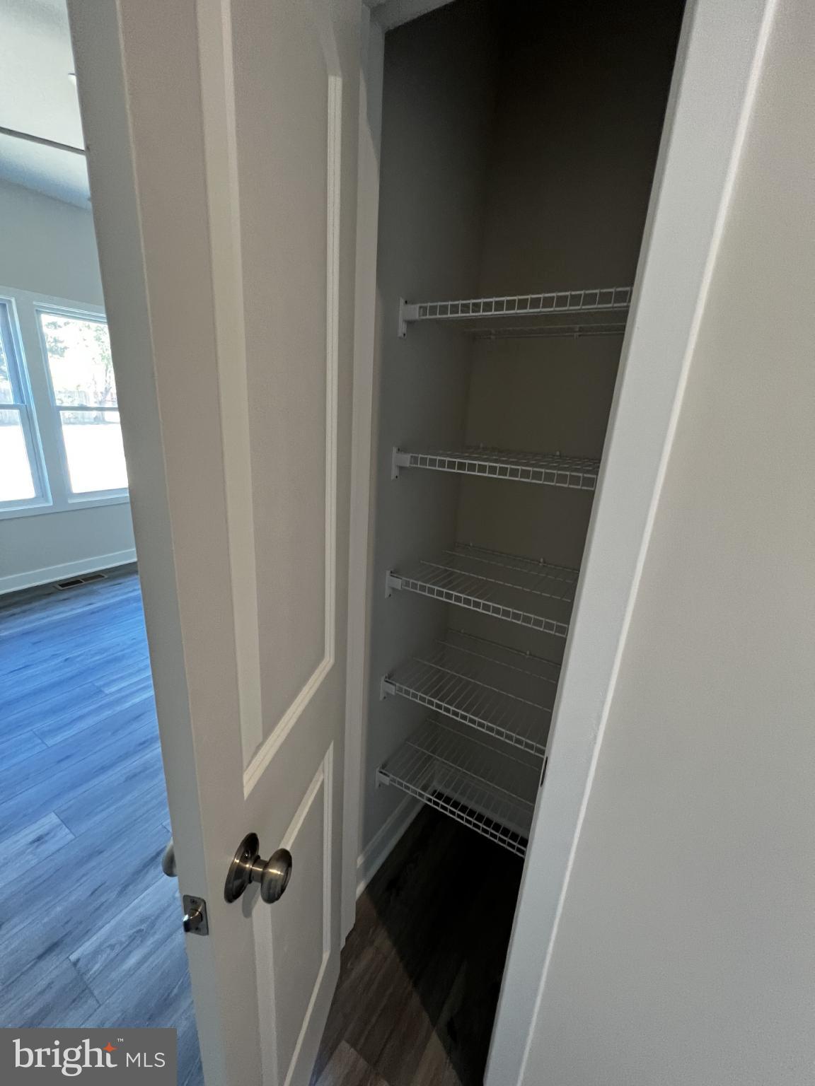 38 Meadow View Lane Colonial Beach, VA 22443 - Photo 16 of 44 Spacious closet with organized shelving.