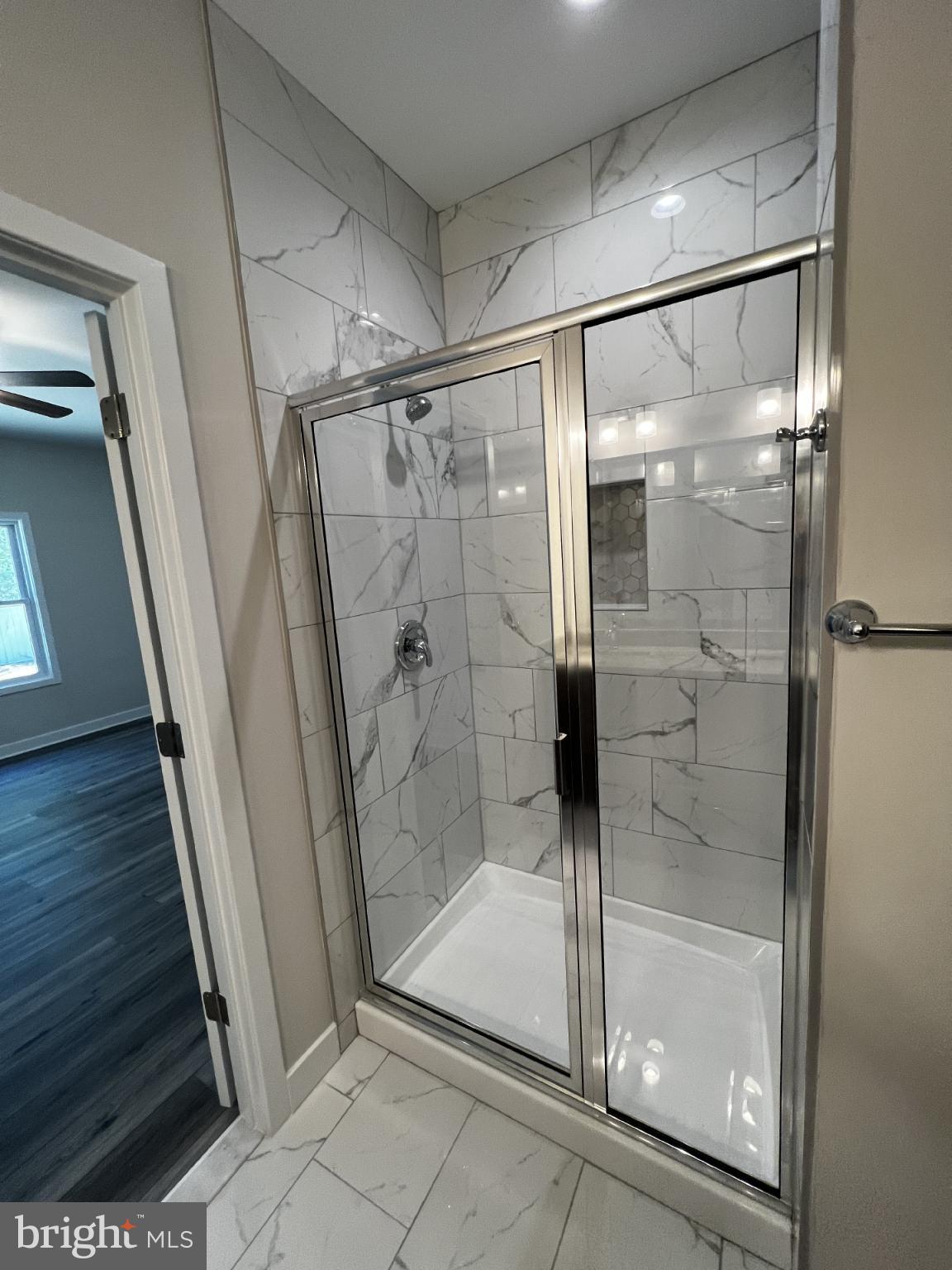 38 Meadow View Lane Colonial Beach, VA 22443 - Photo 34 of 44 Sleek modern shower with elegant tiles.