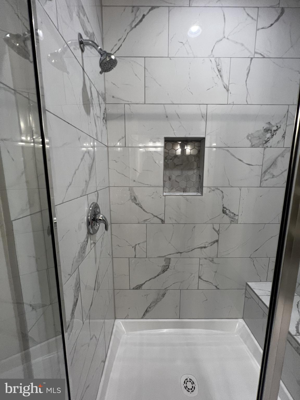 38 Meadow View Lane Colonial Beach, VA 22443 - Photo 35 of 44 Elegant marble shower with modern fixtures.