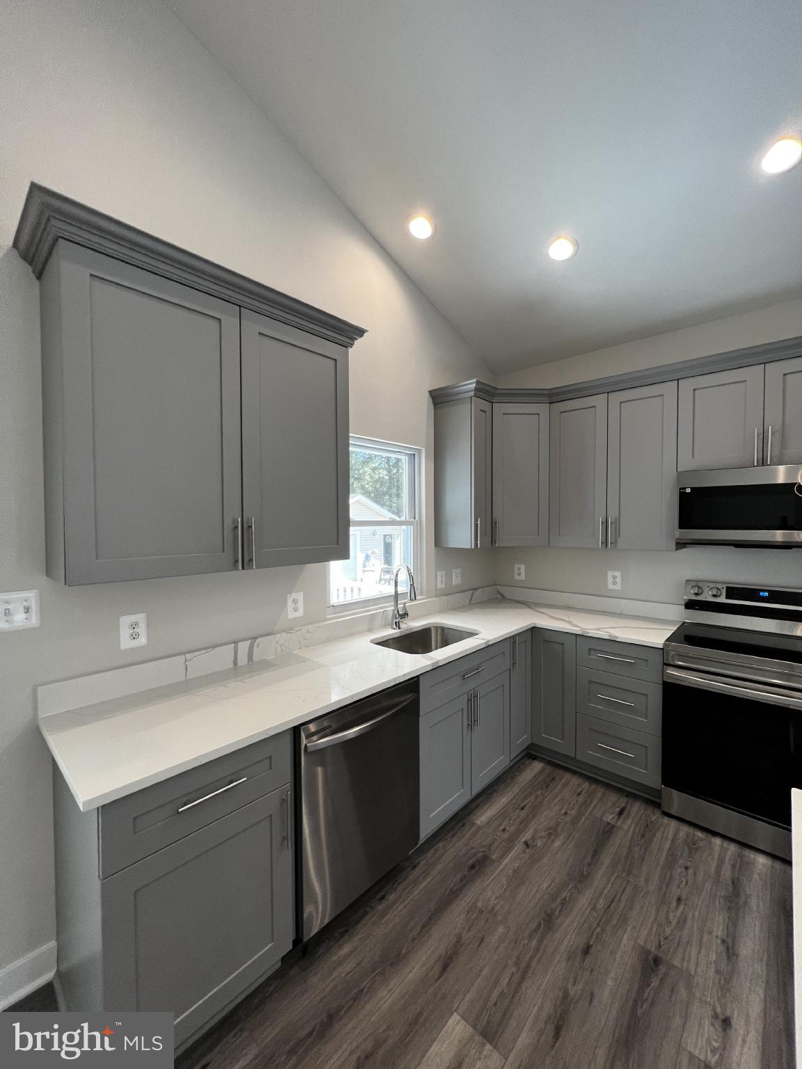 38 Meadow View Lane Colonial Beach, VA 22443 - Photo 37 of 44 Modern kitchen with sleek gray cabinetry.