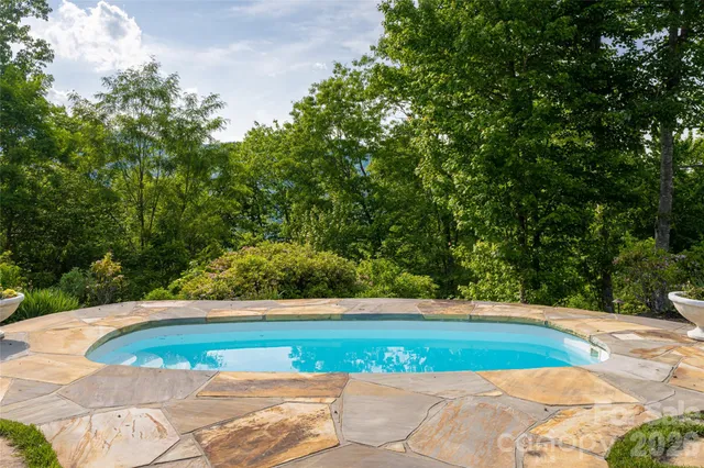 a view of a yard with large trees