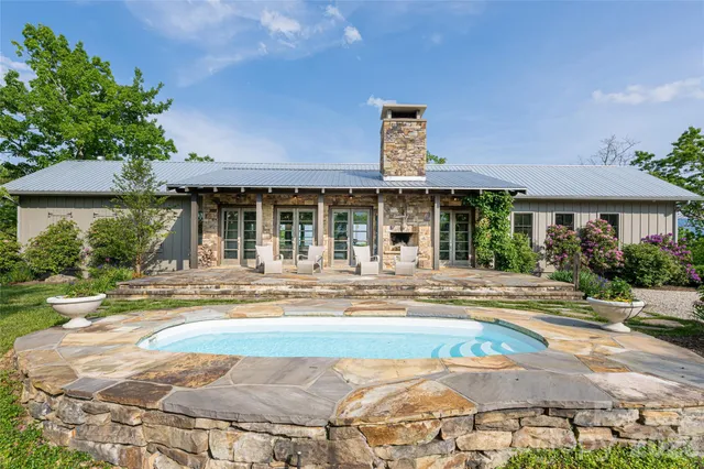 a view of a house with a yard and plants