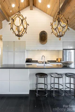 a kitchen with a table chairs and a stove