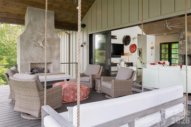 a view of a patio with table and chairs under an umbrella