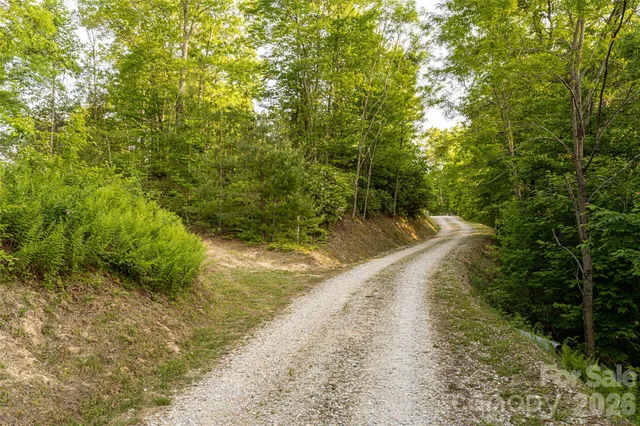an aerial view of a house with table and chairs in patio