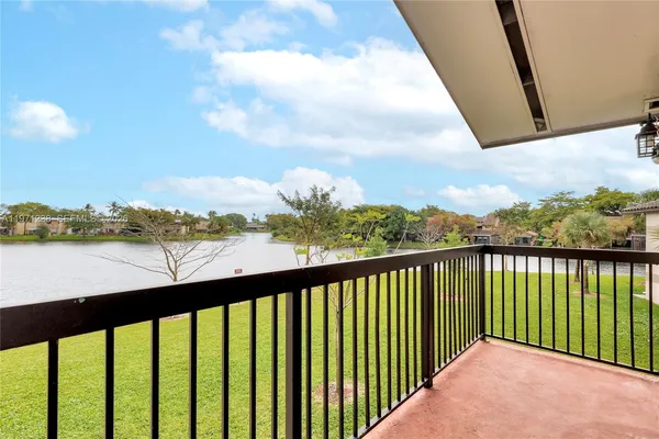 a view of a lake with a big yard