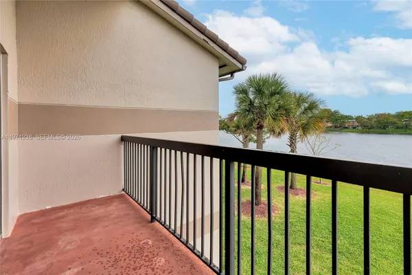 a view of a house with swimming pool and a chairs