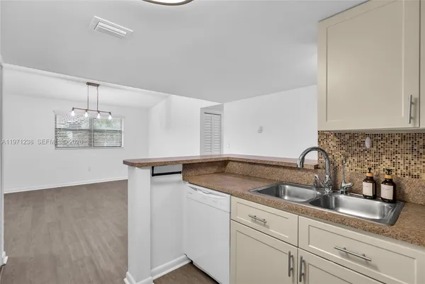 a kitchen with a sink and cabinets