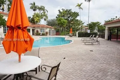 a view of a swimming pool with a lounge chairs