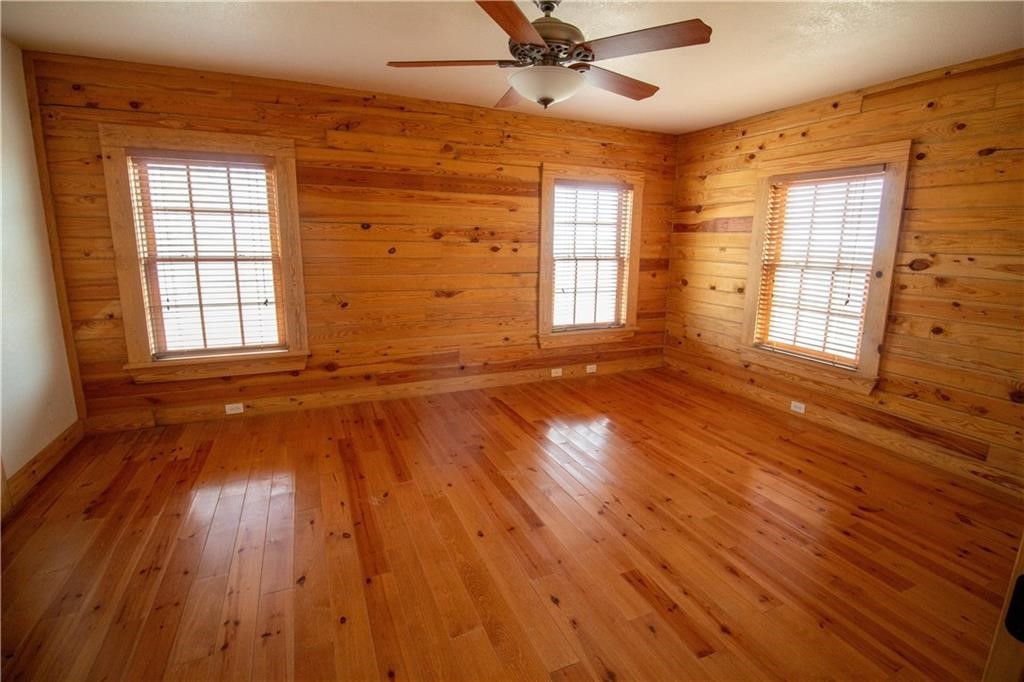 11701 Highway 359 Mathis, TX 78368 - Photo 12 of 35 a view of an empty room with wooden floor and a window