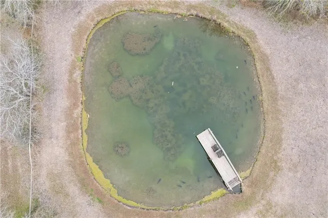 a swimming pool with outdoor seating
