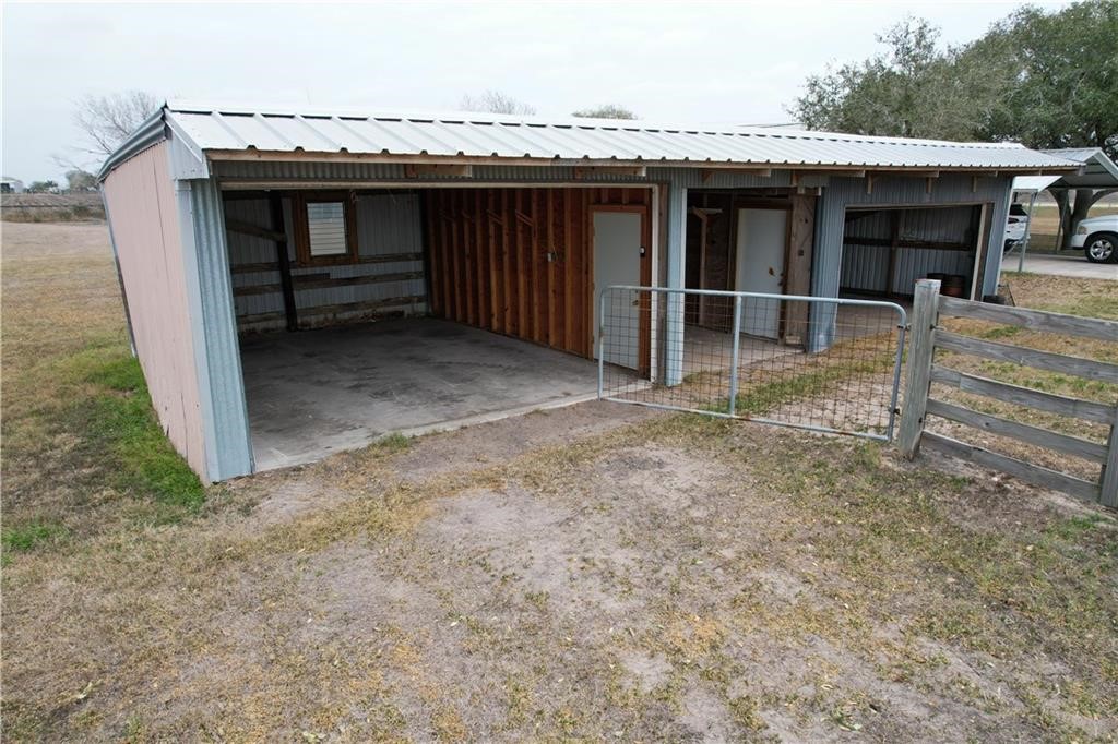 11701 Highway 359 Mathis, TX 78368 - Photo 27 of 35 a view of a house with a balcony and wooden fence