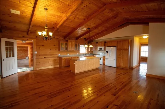 a room with wooden floors and view
