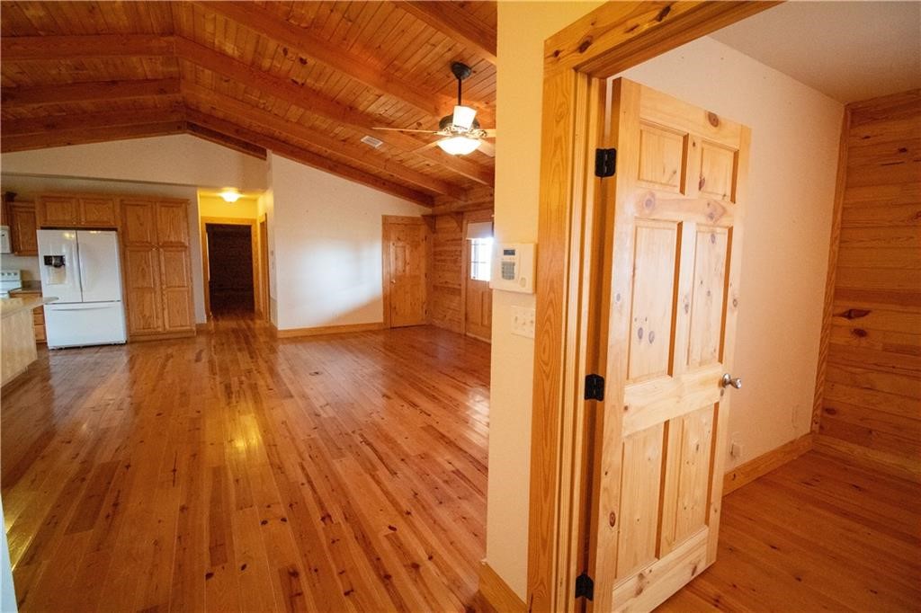 11701 Highway 359 Mathis, TX 78368 - Photo 8 of 35 a view of a hallway with wooden floor and staircase