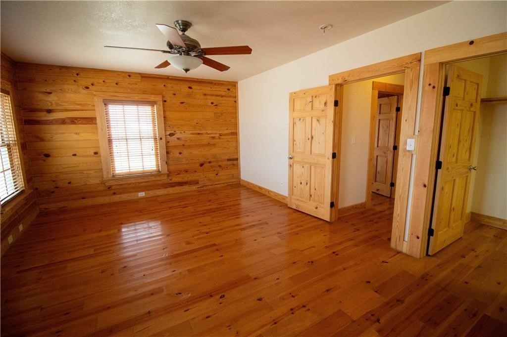 11701 Highway 359 Mathis, TX 78368 - Photo 10 of 35 a view of an empty room with wooden floor and a window