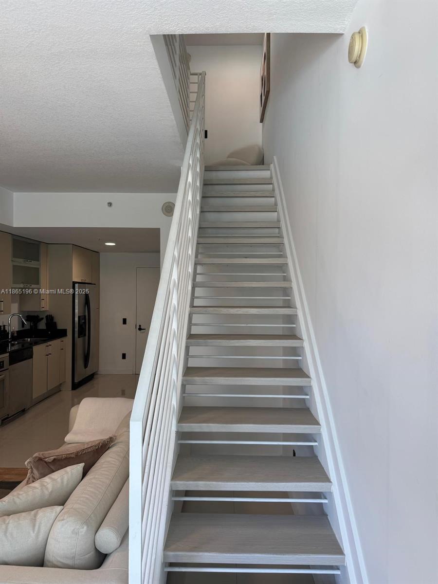60 Southwest 13th Street, Unit 1406 Miami, FL 33130 - Photo 18 of 19 a view of entryway and hall with wooden floor