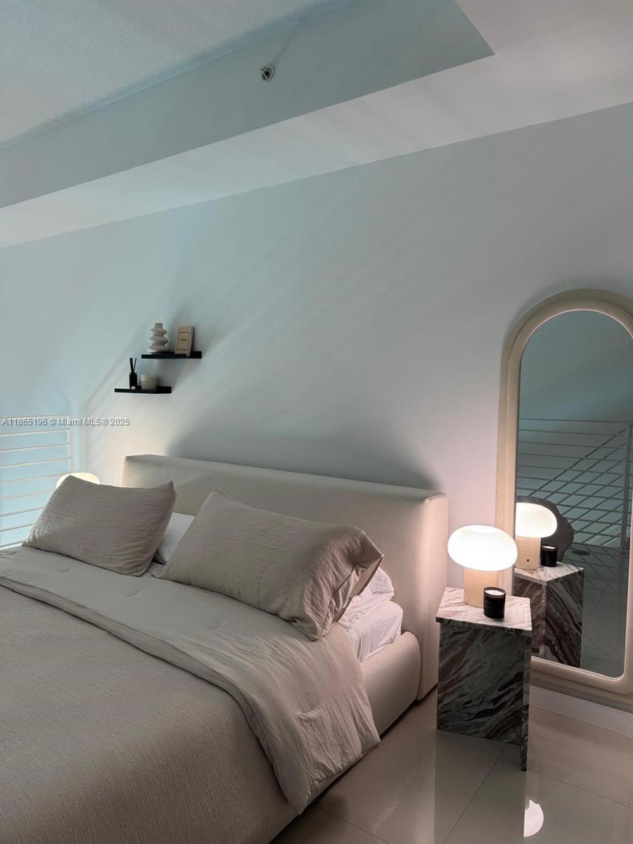 60 Southwest 13th Street, Unit 1406 Miami, FL 33130 - Photo 3 of 19 a bedroom with a bed and window