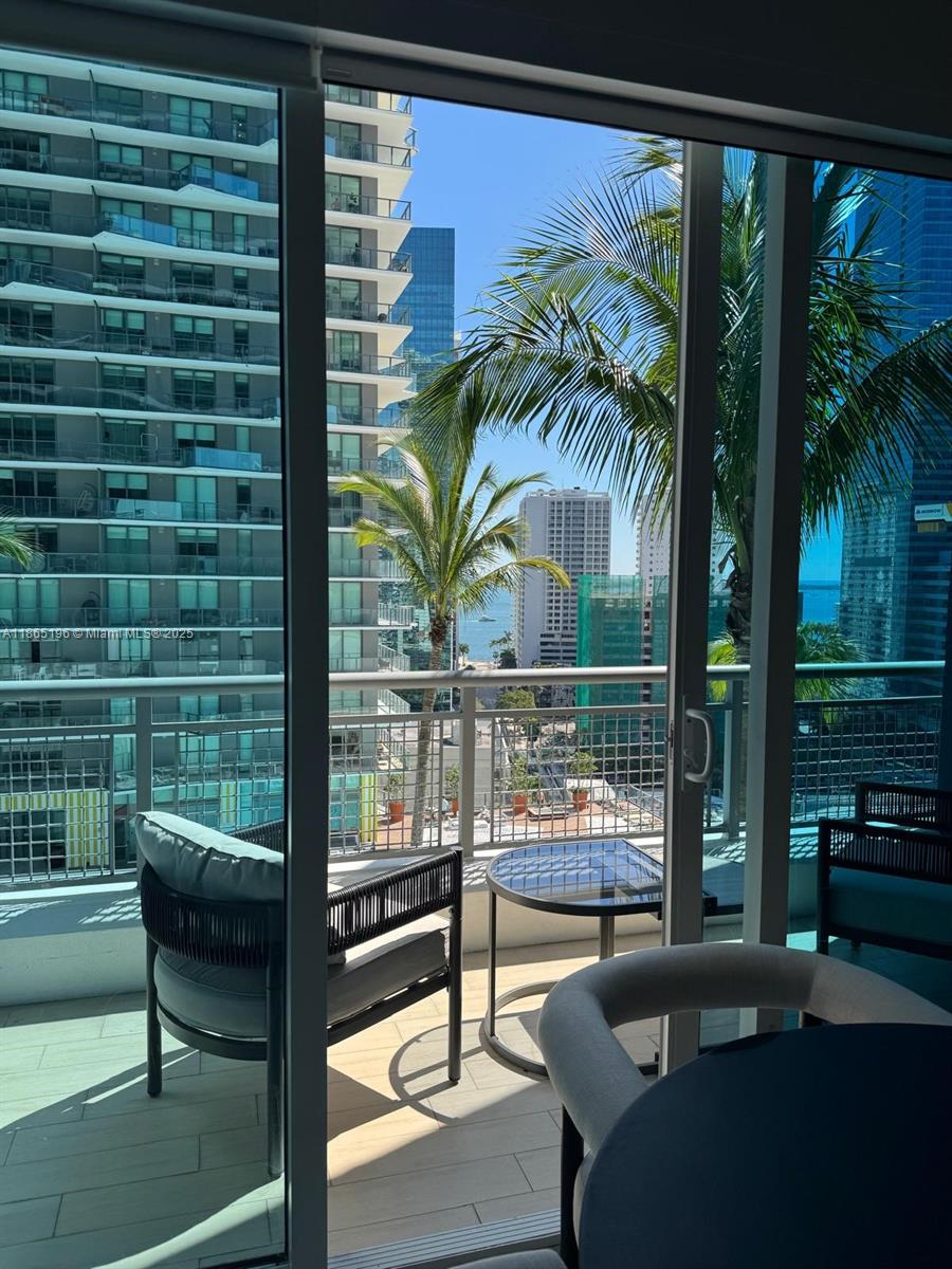 60 Southwest 13th Street, Unit 1406 Miami, FL 33130 - Photo 7 of 19 a view of a balcony with lake view and a potted plant
