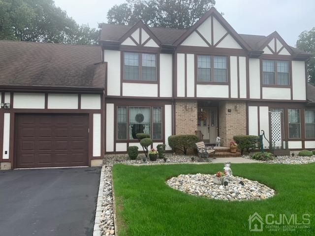 13 Churchill Road Edison, NJ 08820 - Photo 1 of 28 a front view of a house with a garden and yard