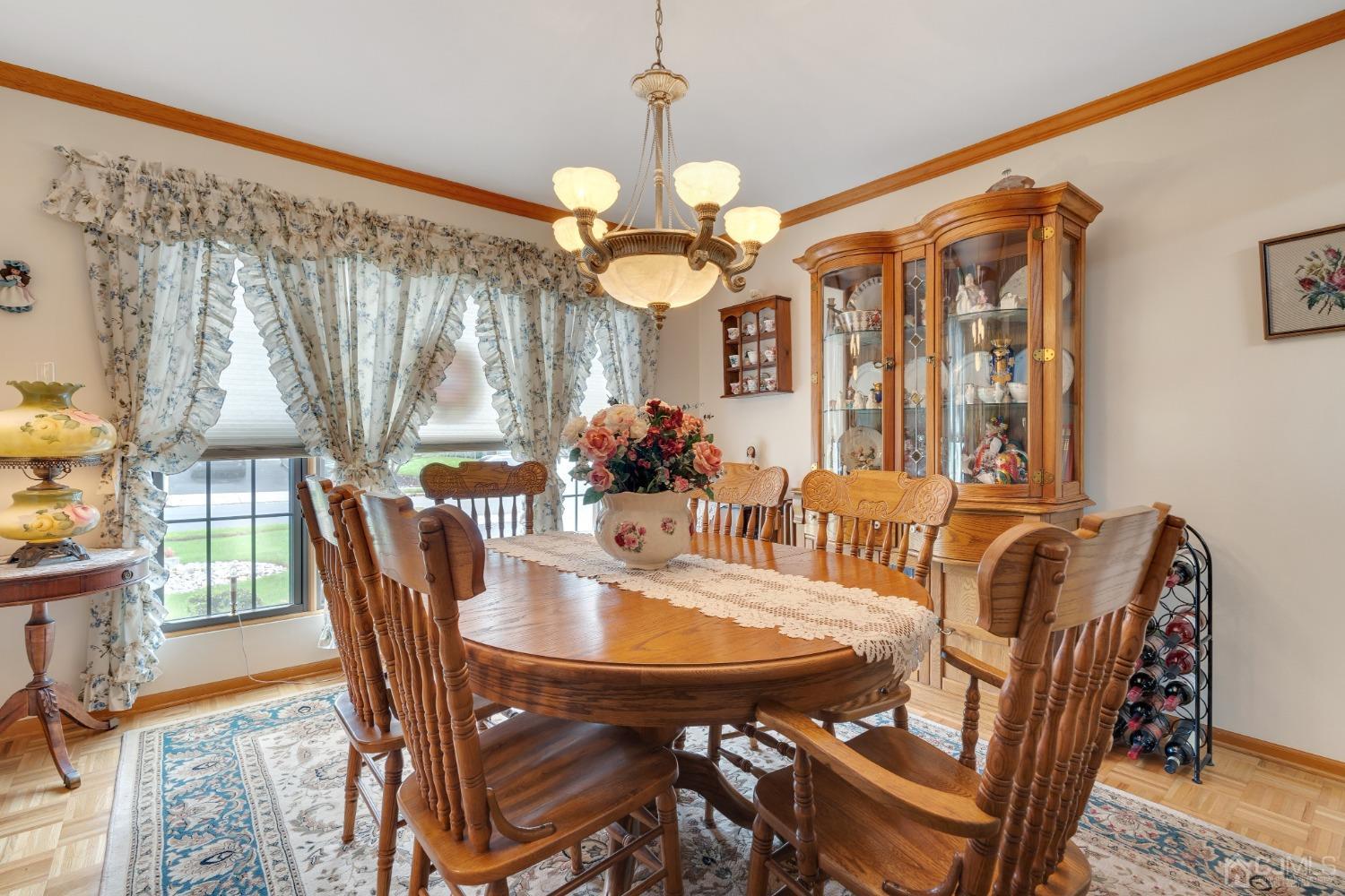 13 Churchill Road Edison, NJ 08820 - Photo 15 of 28 a view of a dining room with furniture and chandelier