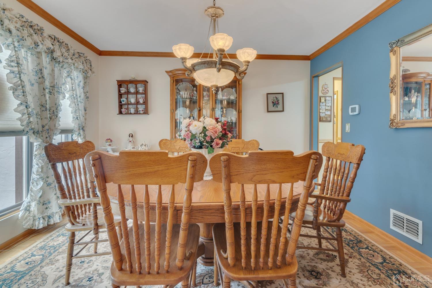 13 Churchill Road Edison, NJ 08820 - Photo 16 of 28 a view of a dining room with furniture and chandelier