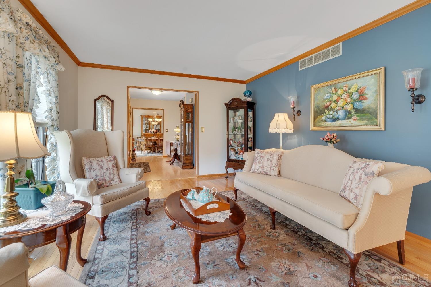 13 Churchill Road Edison, NJ 08820 - Photo 17 of 28 a living room with furniture and wooden floor