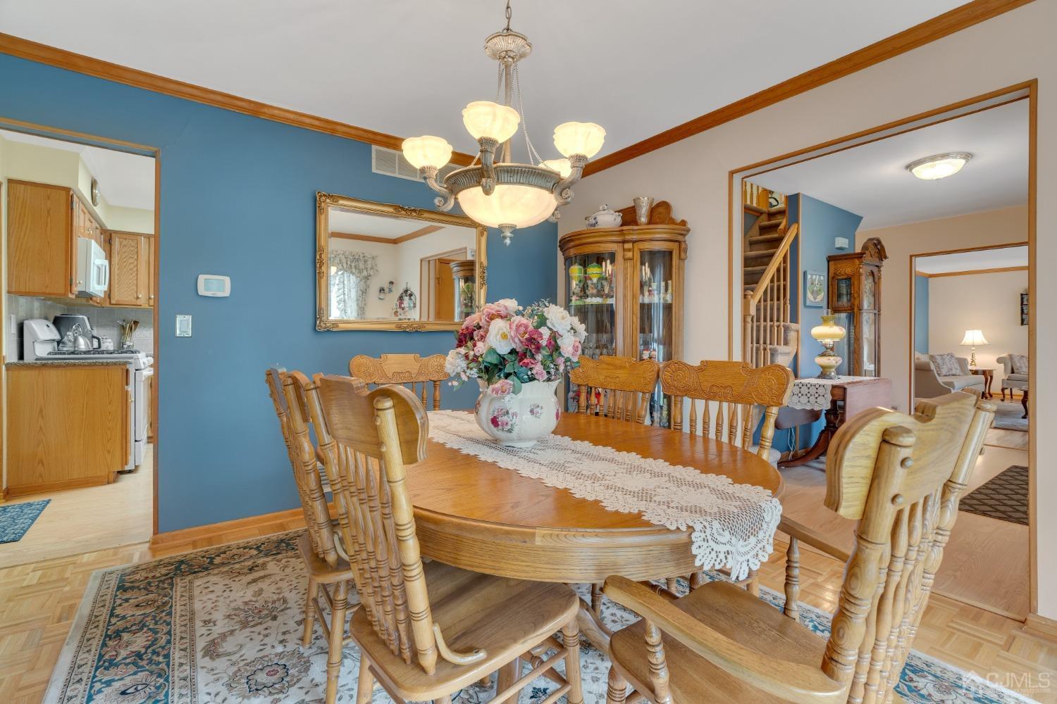 13 Churchill Road Edison, NJ 08820 - Photo 21 of 28 a view of a dining room with furniture and chandelier