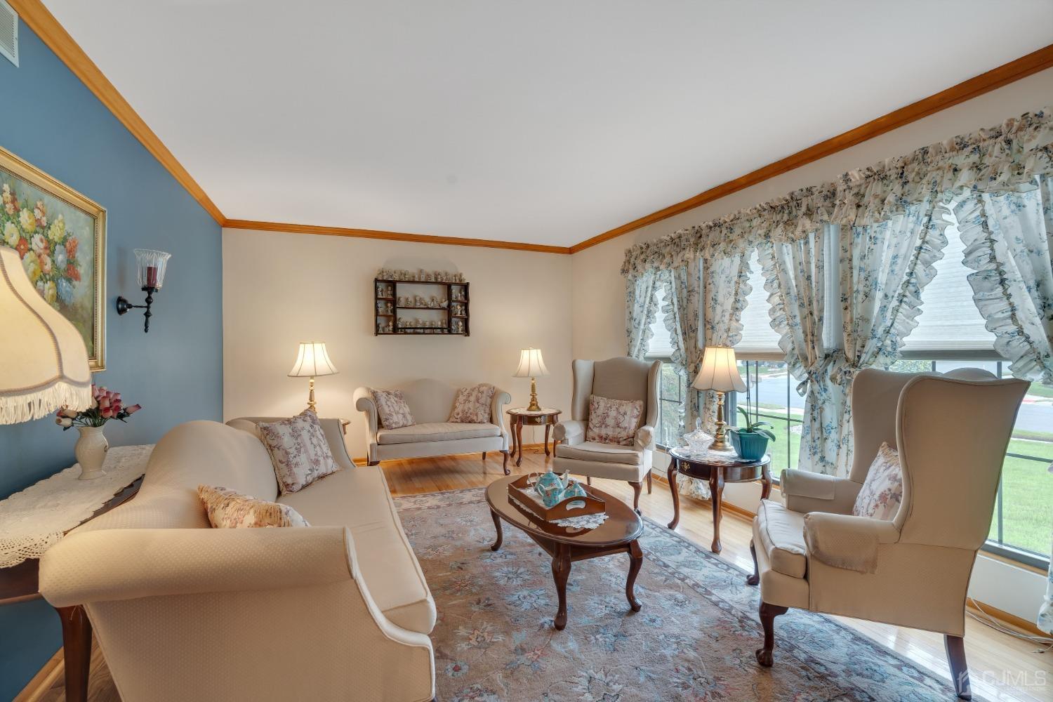 13 Churchill Road Edison, NJ 08820 - Photo 23 of 28 a living room with furniture and a large window