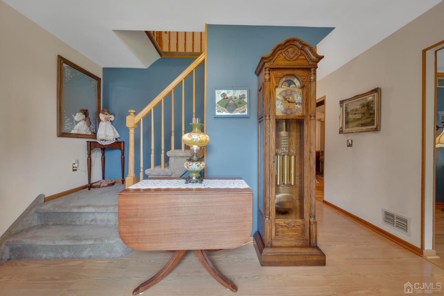 13 Churchill Road Edison, NJ 08820 - Photo 25 of 28 a view of living room with wooden floor and stairs