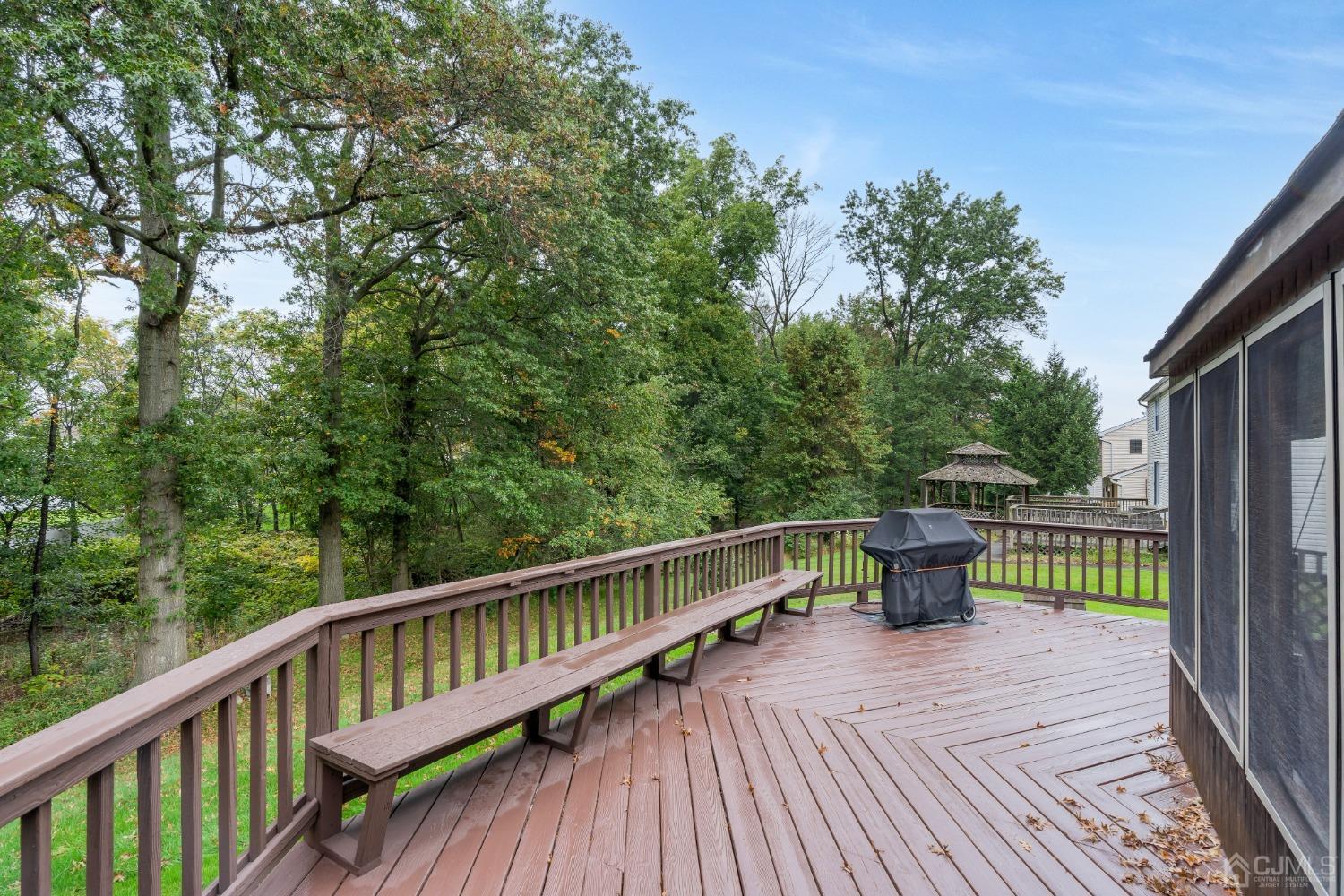 13 Churchill Road Edison, NJ 08820 - Photo 3 of 28 a view of balcony with furniture and trees