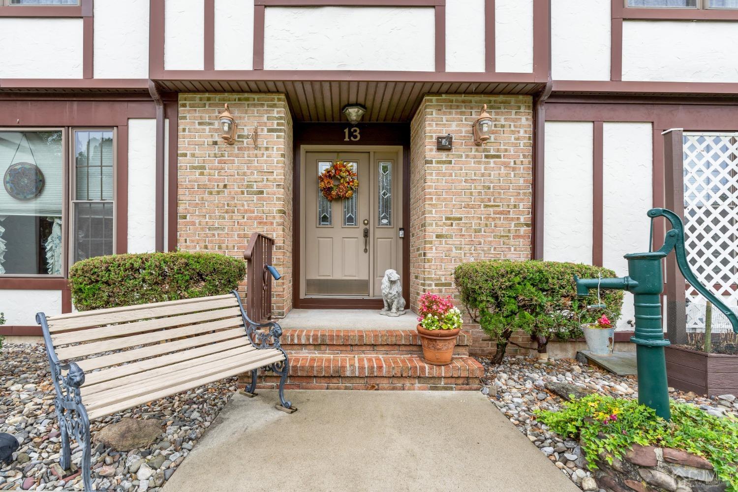 13 Churchill Road Edison, NJ 08820 - Photo 7 of 28 a front view of a house with a garden