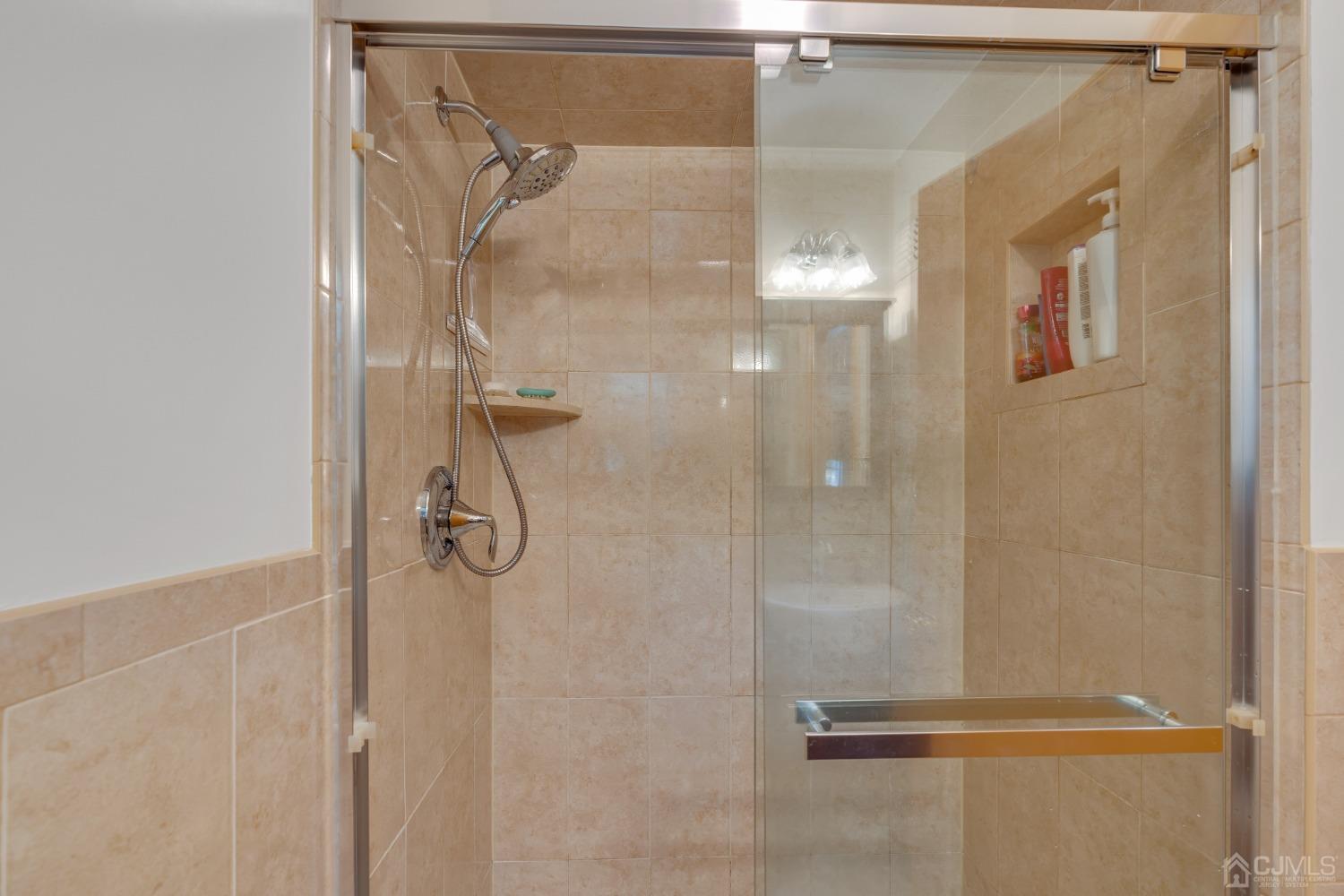 13 Churchill Road Edison, NJ 08820 - Photo 8 of 28 a bathroom with a glass shower door