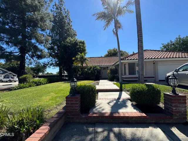 a view of a garden with patio