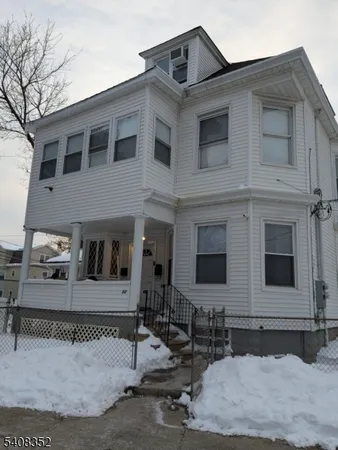 a front view of a house with garage