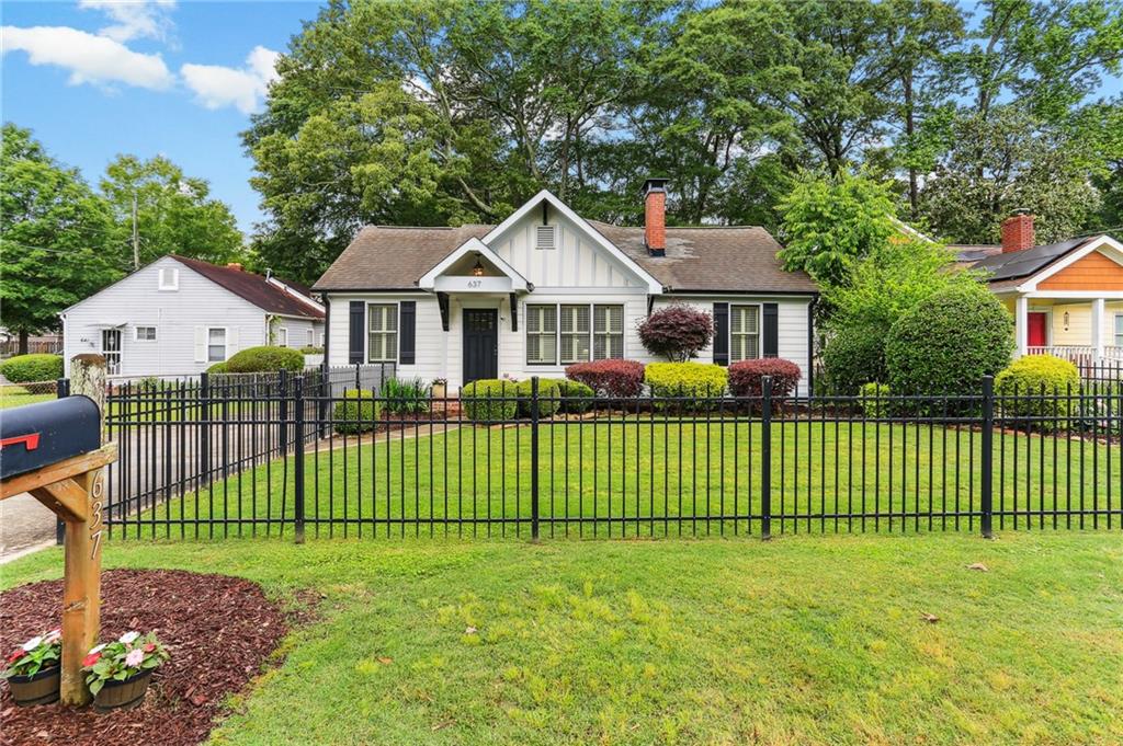 637 Mckoy Street Decatur, GA 30030 - Photo 1 of 1 a front view of a house with a garden and deck