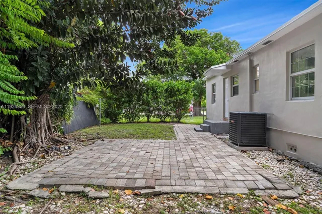 a backyard of a house with lots of green space