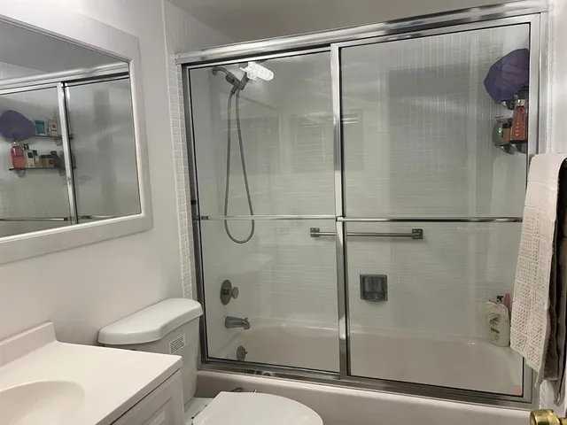 a bathroom with a shower and a tub