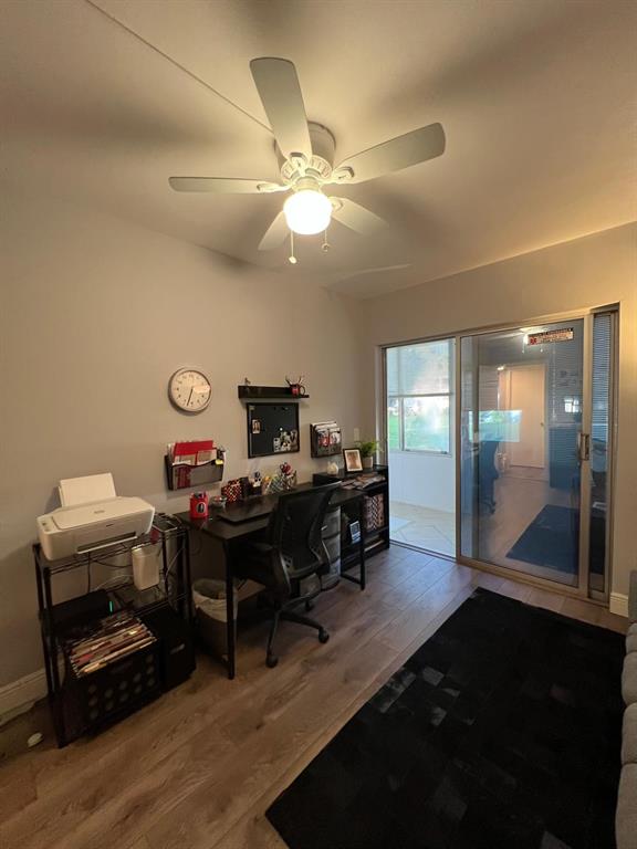 418 Durham, Unit 418 Deerfield Beach, FL 33442 - Photo 16 of 47 a view of a workspace with furniture and a window