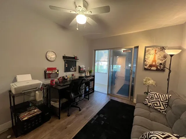 a view of a livingroom with furniture and a chandelier
