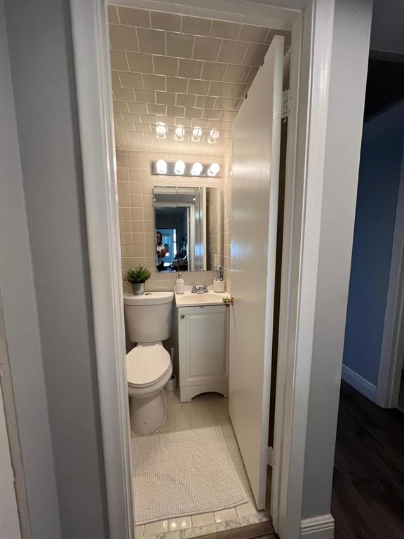 418 Durham, Unit 418 Deerfield Beach, FL 33442 - Photo 22 of 47 a bathroom with a sink a toilet and a mirror