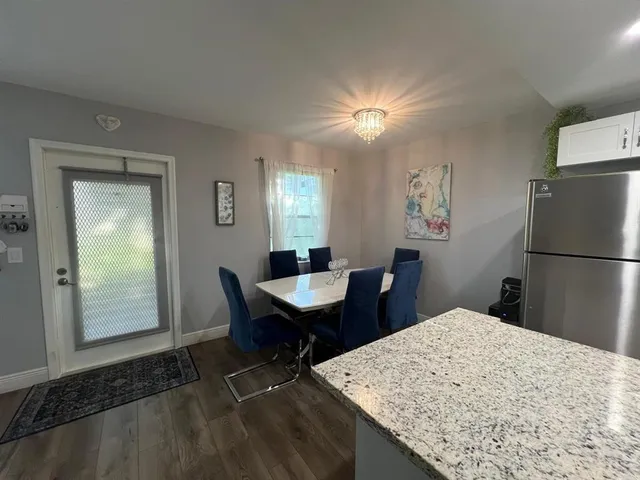 a view of a kitchen and dining room